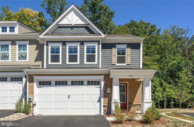 View of front of home with a 2 car garage & 2 parking spots in​​‌​​​​‌​​‌‌​‌‌​​​‌‌​​‌‌​‌​​​​​‌ front | Image 1