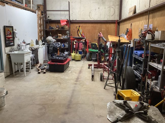 Garage featuring a workshop area | Image 14