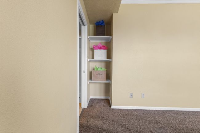 Built-in shelving in Primary Bedroom/bathroom area | Image 19