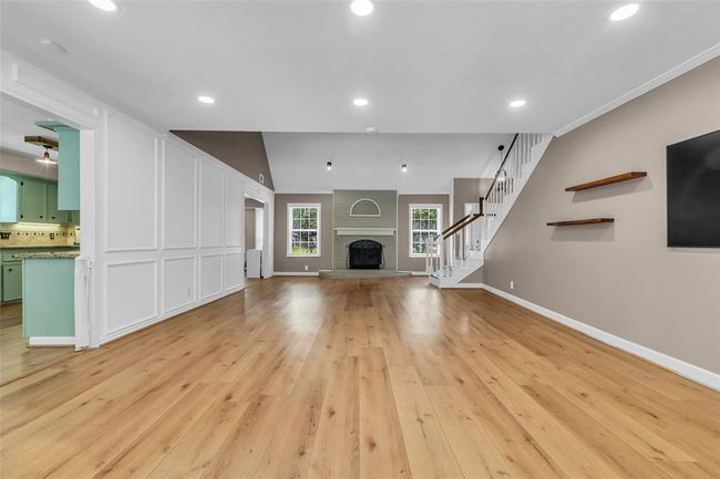 The living room features a custom accent panel wall. | Image 12