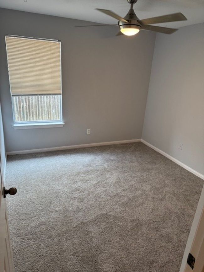Unfurnished room featuring ceiling fan, carpet floors, and baseboards | Image 5