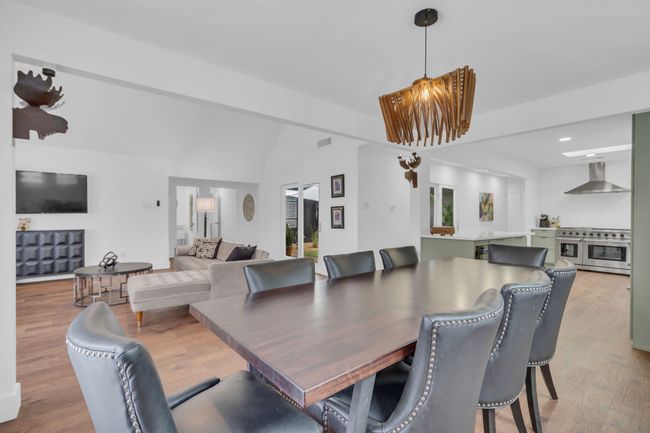 Dining area featuring recessed lighting, vaulted ceiling, and light wood-style flooring | Image 13