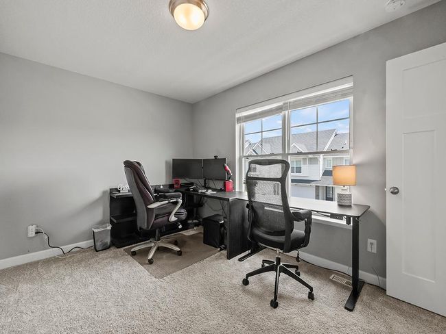 There are two additional upper level bedrooms. 2nd bedroom - currently as an office space | Image 19