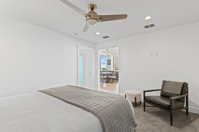 Bedroom featuring light carpet, visible vents, and recessed lighting | Image 14