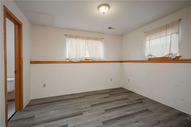 Empty room featuring wood finished floors and baseboards | Image 30