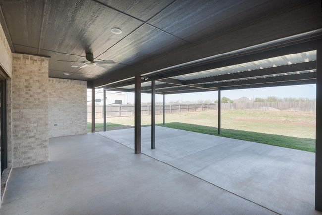 View of patio with fence and a ceiling fan | Image 35