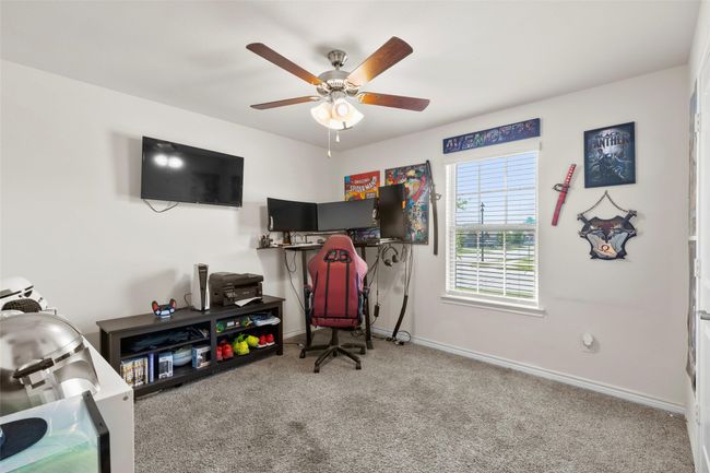Rec room featuring carpet flooring, baseboards, and a ceiling fan | Image 30