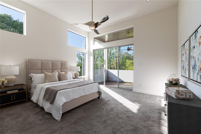 Bedroom with access to outside, multiple windows, carpet floors, and ceiling fan | Image 18