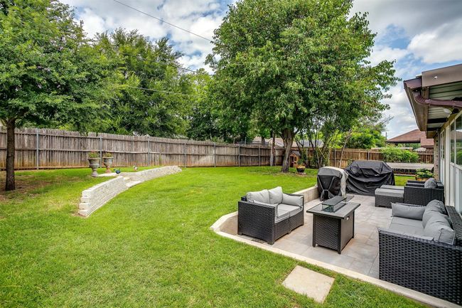 Fenced backyard with outdoor lounge area and a patio | Image 35