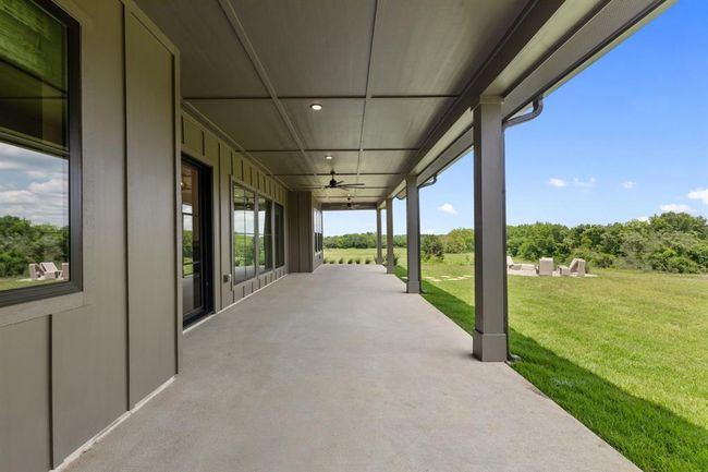 Enjoy breezy afternoons or lazy evenings overlooking the back yard with rolling hilltop views. | Image 41
