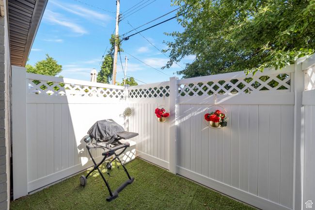 View of fenced backyard | Image 14