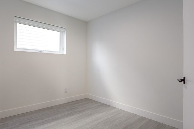 Spare room featuring light wood-type flooring and baseboards | Image 37