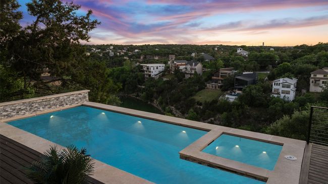 Pool at dusk with an outdoor pool | Image 9
