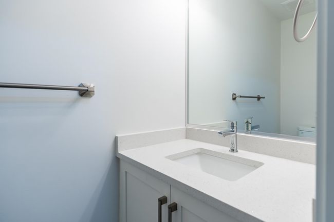 Bathroom featuring vanity and toilet | Image 13