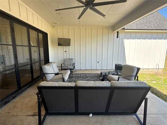 View of patio with outdoor lounge area and a ceiling fan | Image 28