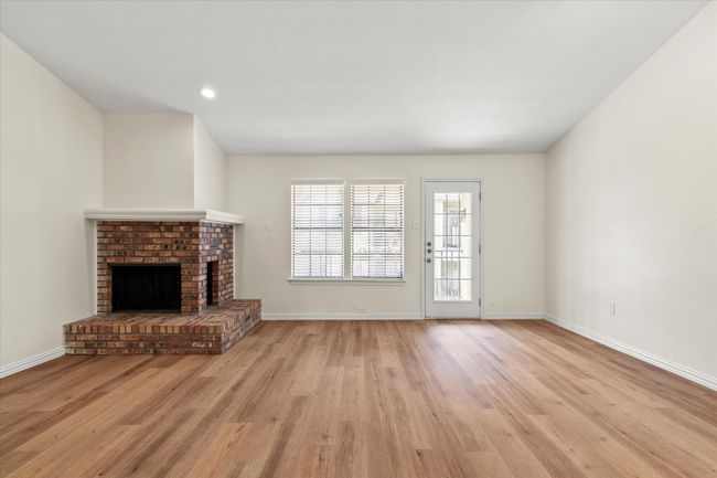 The open concept living area has a dining space and bar area into the kitchen | Image 6