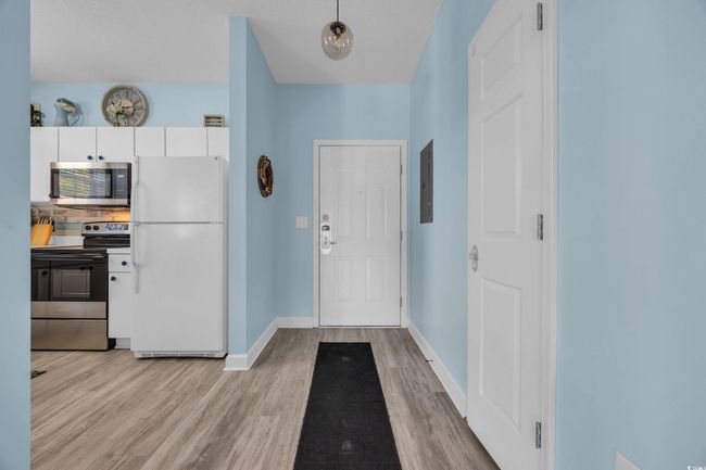 Entrance foyer with light wood-style flooring and baseboards | Image 7