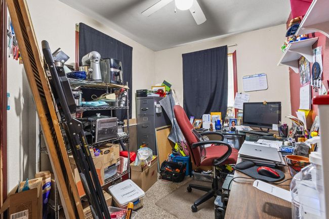 Office space featuring a ceiling fan | Image 18