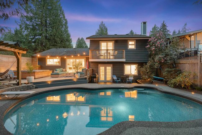 Pool at dusk with a pergola, fence, an outdoor hangout area, an outdoor pool, and french doors | Image 36