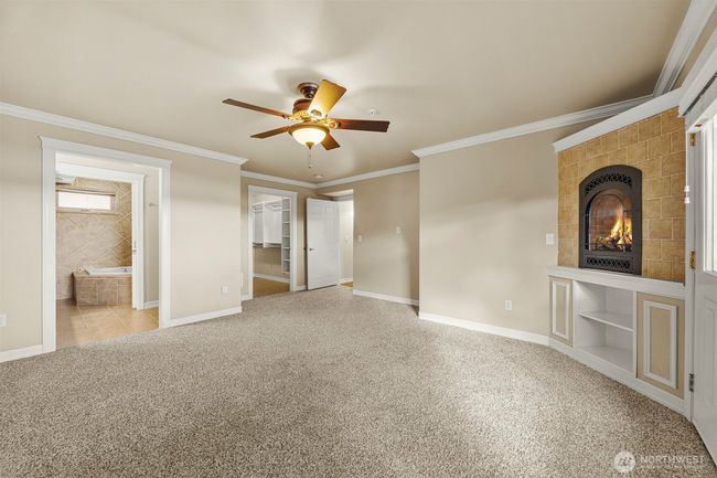 Primary bedroom with large walk in closet and beautiful ensuite bath. | Image 13