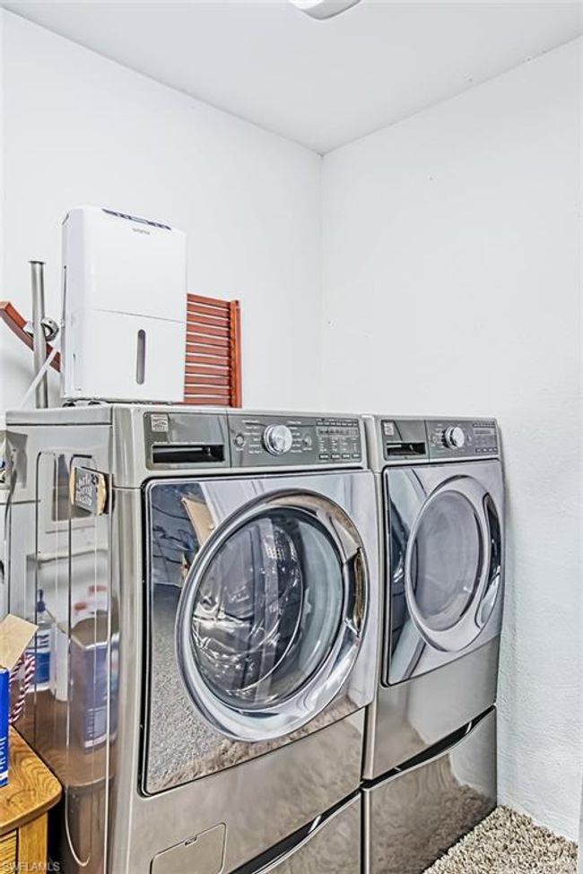 Clothes washing area with washing machine and dryer and laundry area | Image 39