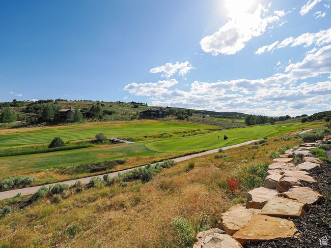 View of yard featuring golf course view | Image 9