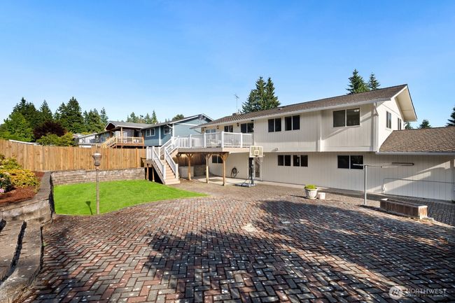 Large brick patio space makes it easy for entertaining | Image 23