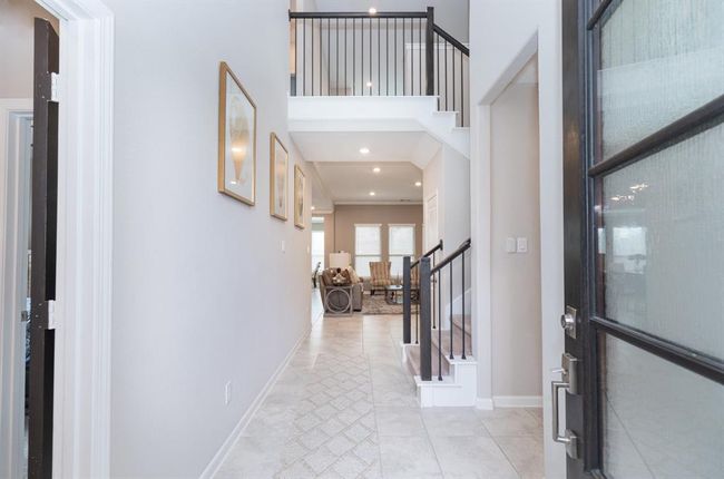 Neutral tones and elegant details enhance the home's contemporary style. | Image 7