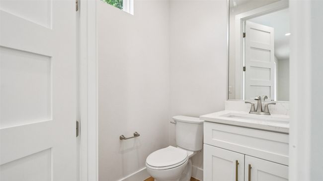Half bathroom with vanity and toilet | Image 22