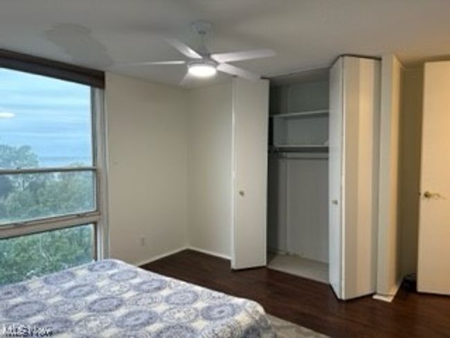 Master bedroom with large closet and lake view | Image 12