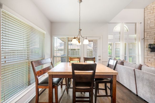 Dining area featuring dark wood-style floors | Image 15