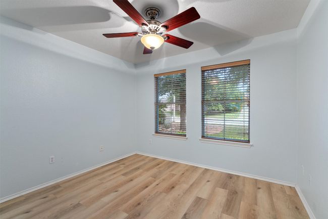 Empty room featuring ceiling fan/light combination | Image 24