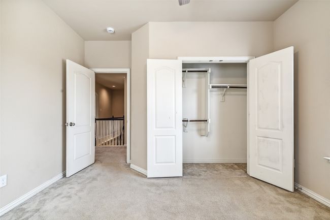 Unfurnished bedroom featuring carpet, baseboards, and a closet | Image 18