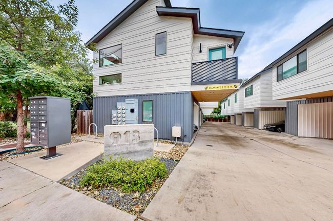 View of front of home featuring metal roof, a standing seam roof, and a balcony | Image 8