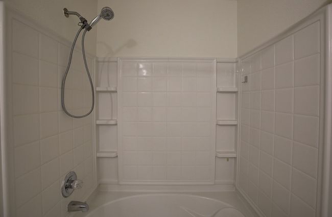 Primary bathroom featuring washtub / shower combination | Image 29