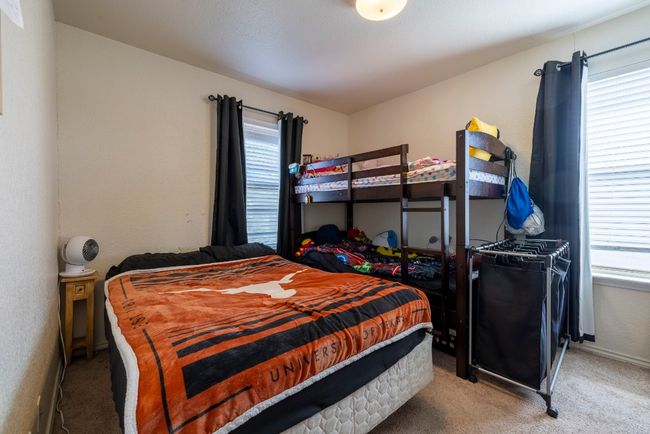 Bedroom with carpet floors and baseboards | Image 13