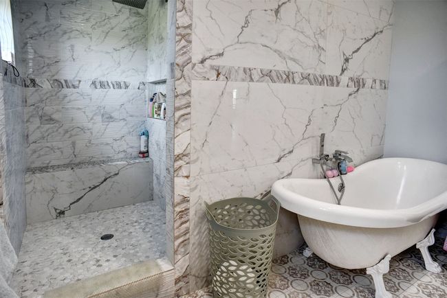 Master bathroom showing bath tub and separate walking shower | Image 24
