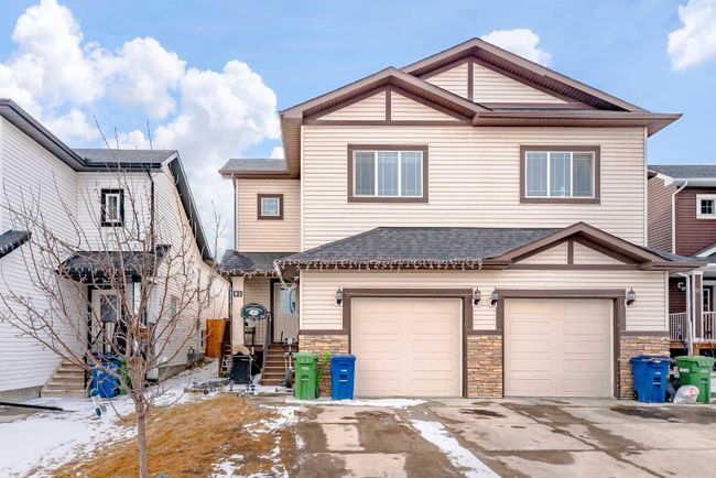 83 Baysprings Way Sw, Home with 5 bedrooms, 3 bathrooms and 2 parking in Airdrie AB | Image 1