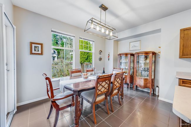 Dining space featuring baseboards and dark tile patterned floors | Image 6