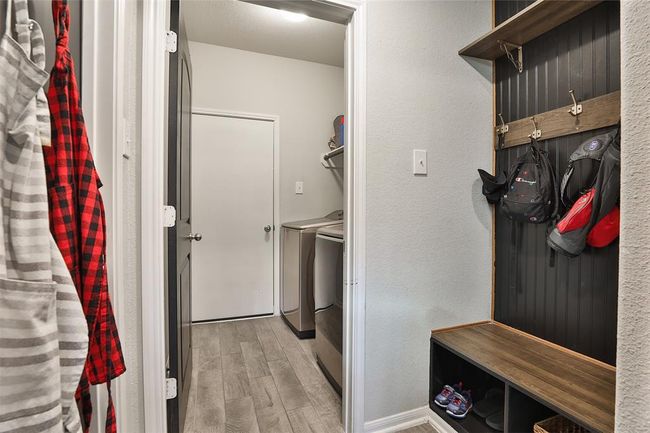 BONUS! A built-in mud space leads to the utility room, offering a convenient area to store items and keep your home free of clutter. | Image 13