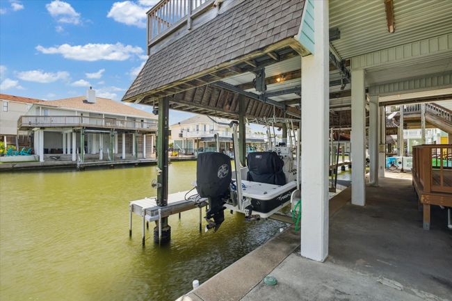 Enjoy the convenience of a platform lift and a boatlift, perfect for waterfront living. | Image 30