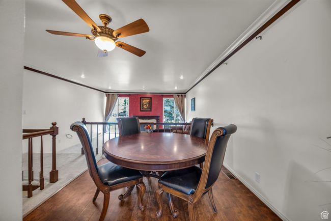 Dining space featuring visible vents, ceiling fan, crown molding, recessed lighting, and wood finished floors | Image 13