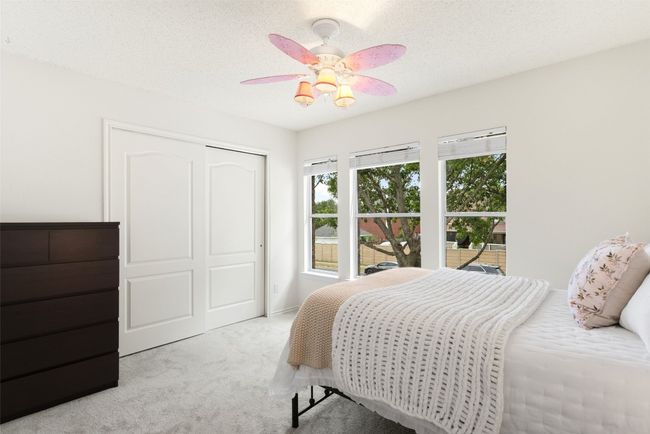 Discover your perfect oasis in this beautifully updated bedroom, featuring new carpet, freshly painted walls, a spacious large closet, and serene views of a majestic oak tree—ideal for comfortable living! | Image 27