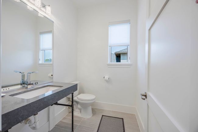 Half bath featuring baseboards and toilet | Image 26