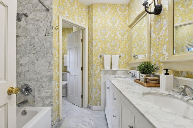 Beautiful primary ensuite features heated marble floors and double sink vanity. | Image 15