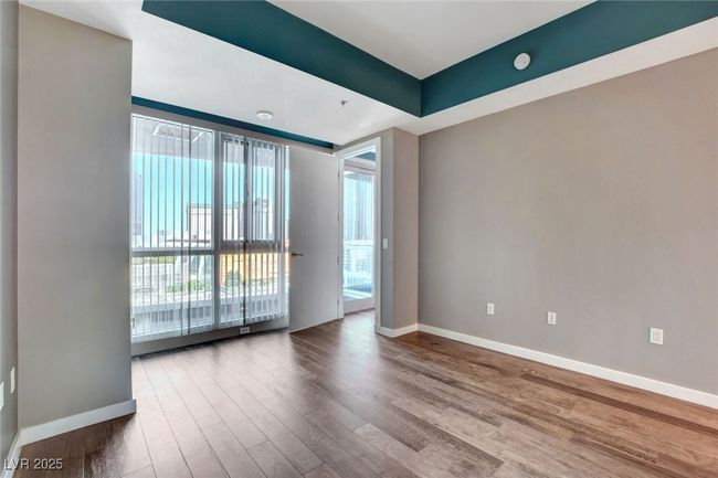 Primary bed room with baseboards and wood finished floors | Image 20