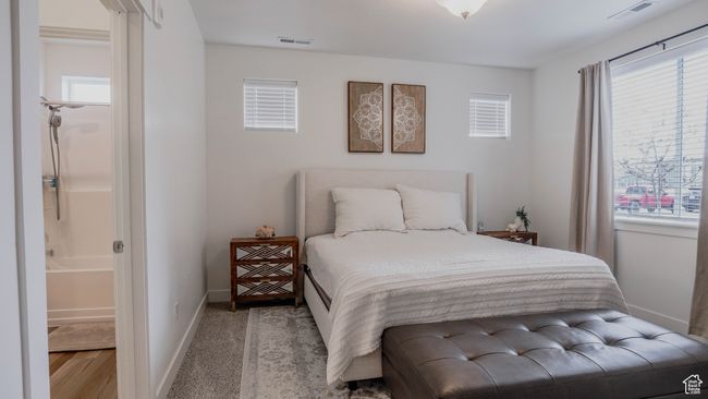 Bedroom with multiple windows and visible vents | Image 20