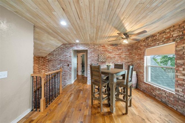The spacious game room is ideal for gatherings and leisure activities, providing ample space for entertainment. | Image 31