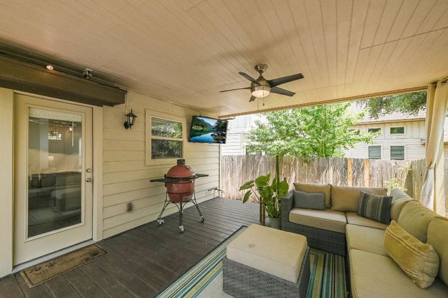 Wooden terrace with an outdoor living space and a ceiling fan | Image 29