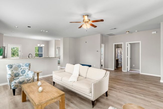 Living area. Doors to right go to the guest bedrooms. | Image 10
